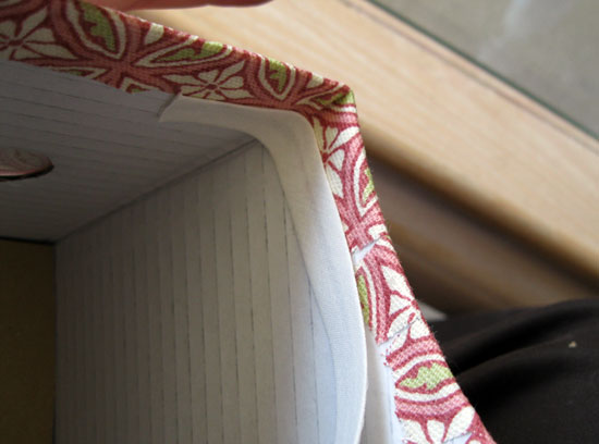 25. Starting near an interior corner, apply bias tape to cover raw edges of fabric.
